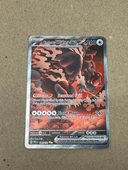 PRISMATIC EVOLUTIONS BLOODMOON URSALUNA ex 168/131  RAW  PK1448